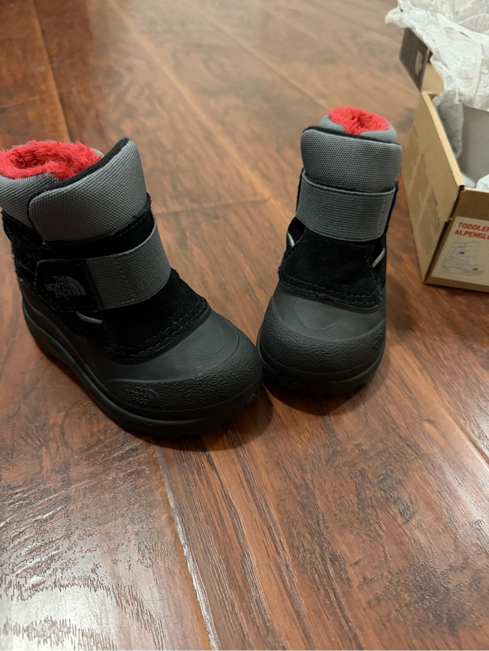 The North Face Kids Black and Gray Waterproof Snow Boots with Red Lining